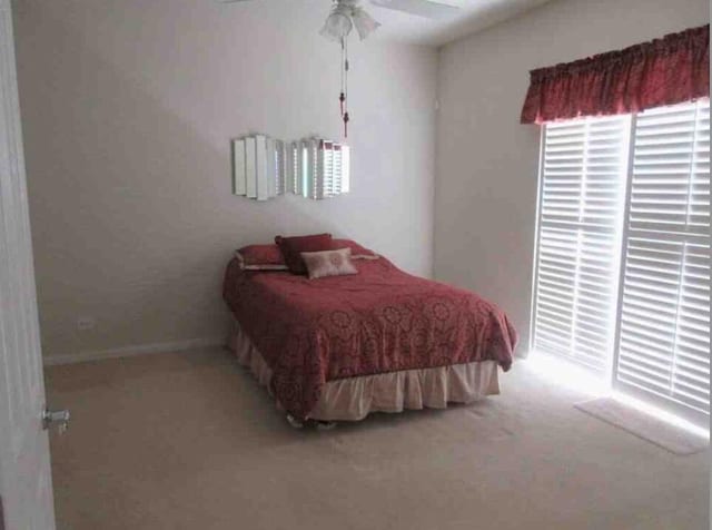 3531 Plume Way SE, Palm Bay, FL 32909 - bedroom featuring baseboards, a ceiling fan, and light carpet