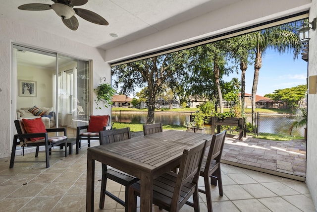 8881 Livingston Way, Boynton Beach, FL 33472 - sunroom with outdoor dining area, a water view, and ceiling fan