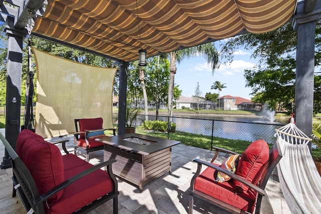 8881 Livingston Way, Boynton Beach, FL 33472 - view of patio featuring fence, an outdoor living space with a fire pit, and a water view