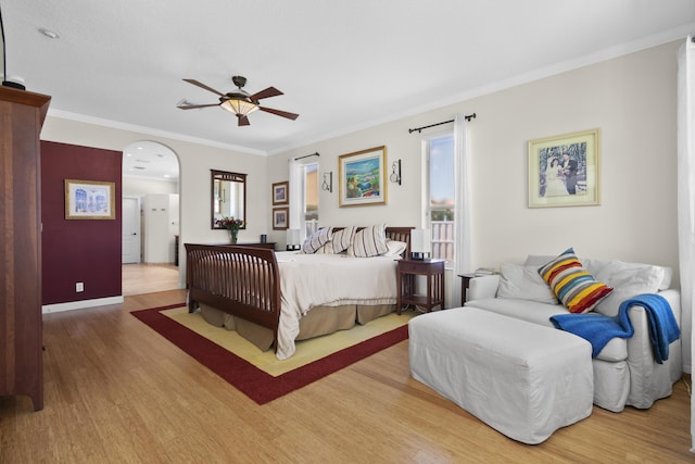 8881 Livingston Way, Boynton Beach, FL 33472 - bedroom with crown molding, arched walkways, baseboards, and wood finished floors