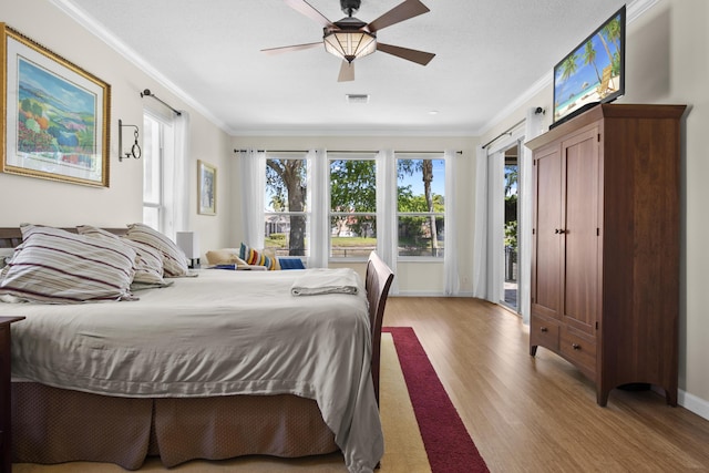 8881 Livingston Way, Boynton Beach, FL 33472 - bedroom featuring visible vents, ornamental molding, wood finished floors, and access to exterior