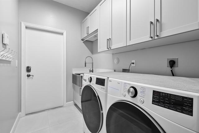 8881 Livingston Way, Boynton Beach, FL 33472 - washroom with cabinet space, independent washer and dryer, baseboards, and light tile patterned floors