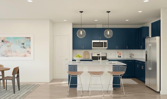317 Silver Sands Ln Unit 10, Fort Pierce, FL 34945 - kitchen with recessed lighting, backsplash, stainless steel appliances, and blue cabinetry
