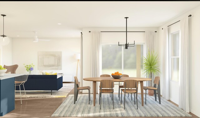 317 Silver Sands Ln Unit 10, Fort Pierce, FL 34945 - dining room featuring a chandelier, recessed lighting, wood finished floors, and baseboards