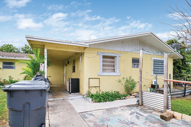 3208 Prince Dr, Lake Worth, FL 33461 - bungalow-style house with an attached carport and stucco siding