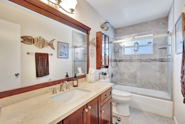 387 Yvonne Dr, West Palm Beach, FL 33406 - full bath featuring toilet, vanity, bath / shower combo with glass door, and tile patterned floors