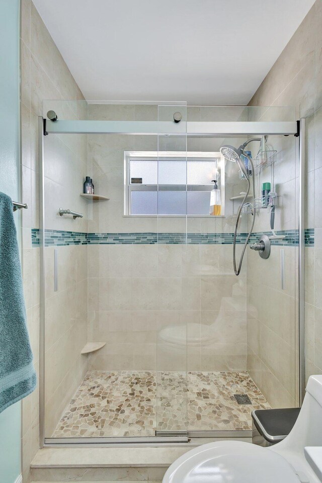 387 Yvonne Dr, West Palm Beach, FL 33406 - full bath featuring a shower stall and toilet