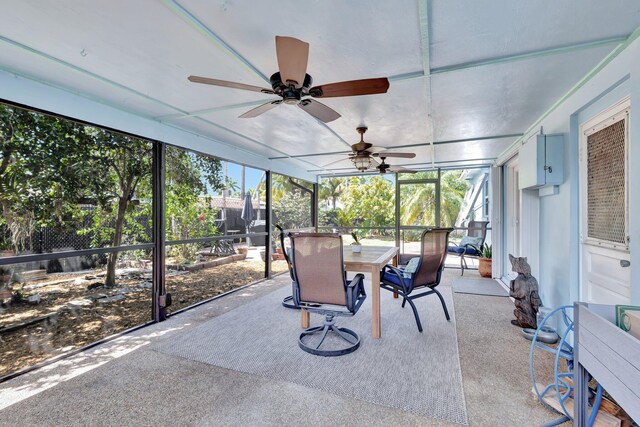 387 Yvonne Dr, West Palm Beach, FL 33406 - sunroom / solarium with outdoor dining space, ceiling fan, and carpet