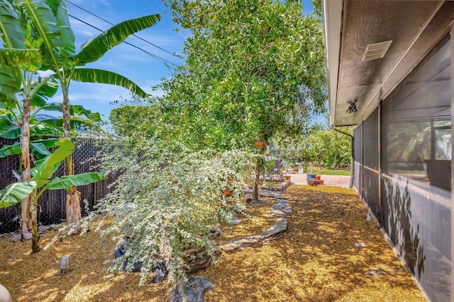 387 Yvonne Dr, West Palm Beach, FL 33406 - sunroom / solarium featuring outdoor dining area, ceiling fan, and healthy amount of natural light