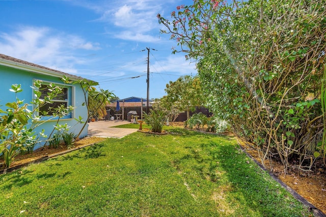 387 Yvonne Dr, West Palm Beach, FL 33406 - view of yard featuring a patio area
