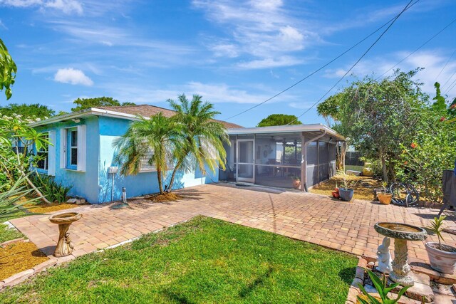 387 Yvonne Dr, West Palm Beach, FL 33406 - view of yard with a patio