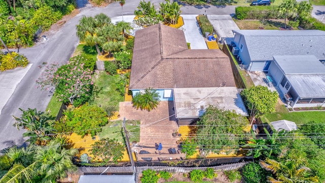 387 Yvonne Dr, West Palm Beach, FL 33406 - aerial perspective of suburban area with a tree filled landscape