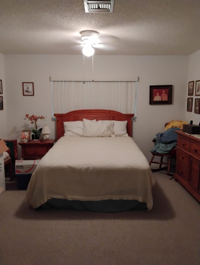 131 Lakes End Dr Unit D, Fort Pierce, FL 34982 - bedroom featuring light carpet and a textured ceiling