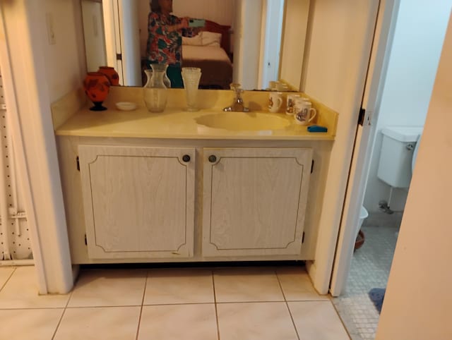 131 Lakes End Dr Unit D, Fort Pierce, FL 34982 - bathroom with toilet, vanity, and tile patterned floors
