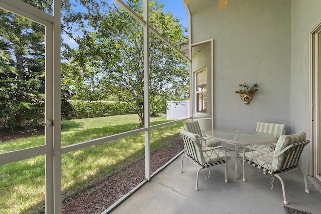 sunroom / solarium with outdoor dining space
