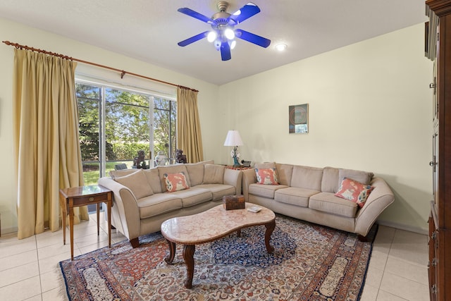 living room with light tile patterned flooring, a ceiling fan, recessed lighting, and baseboards