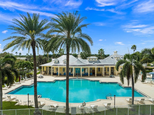 pool featuring a patio and fence