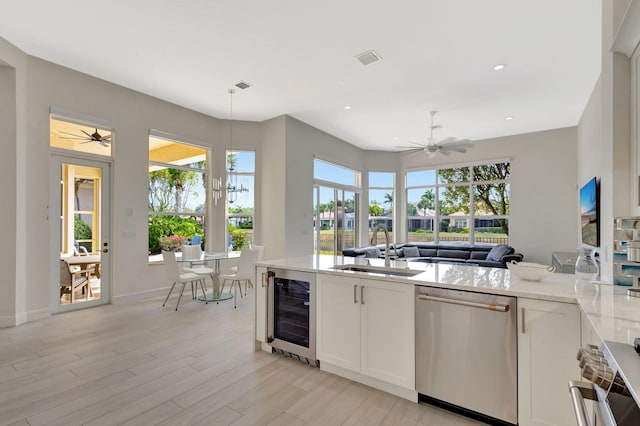 112 Dalena Way, Palm Beach Gardens, FL 33418 - kitchen with wine cooler, stainless steel dishwasher, a ceiling fan, and a sink
