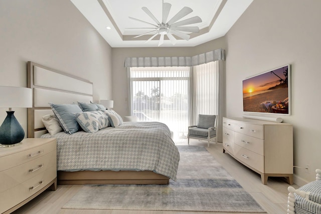112 Dalena Way, Palm Beach Gardens, FL 33418 - bedroom featuring light wood-type flooring, a raised ceiling, and ceiling fan