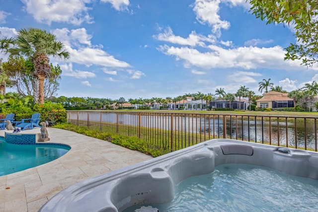 112 Dalena Way, Palm Beach Gardens, FL 33418 - view of swimming pool featuring a hot tub, a water view, fence, and a patio