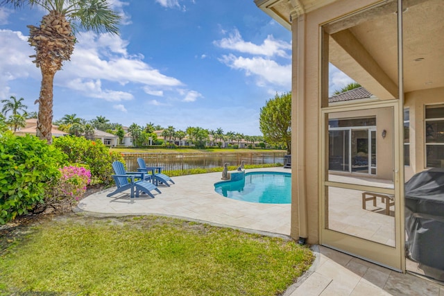 112 Dalena Way, Palm Beach Gardens, FL 33418 - view of swimming pool with fence, a fenced in pool, a patio area, a water view, and a yard