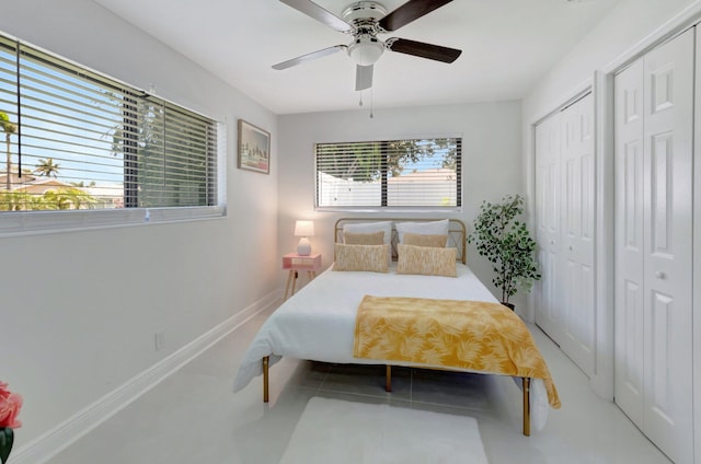 918 Turner Rd, Delray Beach, FL 33483 - bedroom featuring baseboards, a ceiling fan, and two closets