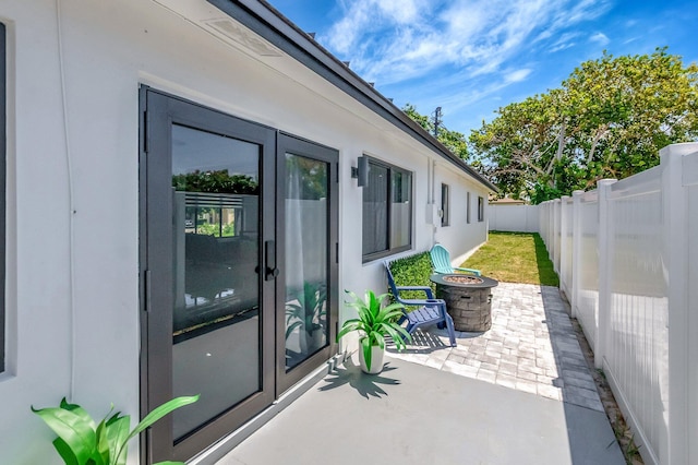 918 Turner Rd, Delray Beach, FL 33483 - view of patio / terrace with a fenced backyard and a fire pit