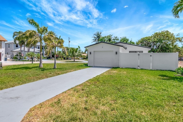 918 Turner Rd, Delray Beach, FL 33483 - view of front of property with a front yard, a gate, fence, concrete driveway, and an attached garage