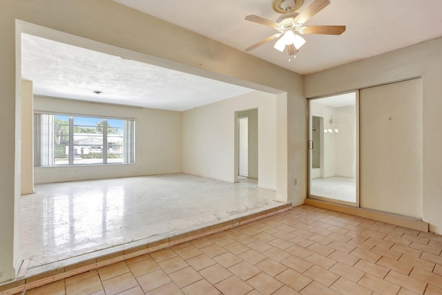 unfurnished room with a ceiling fan