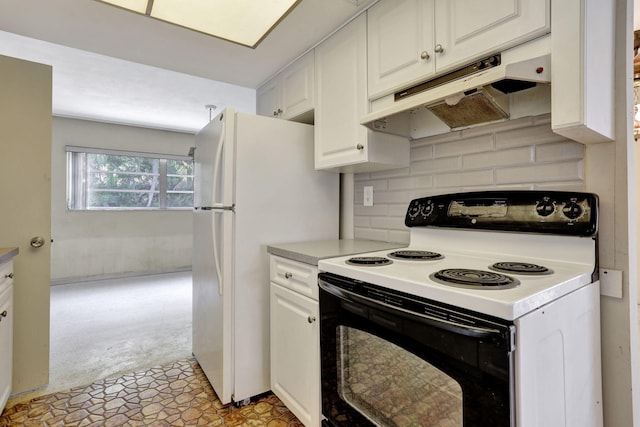kitchen with freestanding refrigerator, electric range oven, white cabinetry, under cabinet range hood, and tasteful backsplash