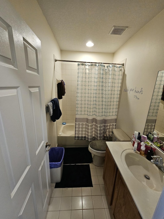 2128 Oakmont Dr Unit 2128, Riviera Beach, FL 33404 - bathroom featuring toilet, vanity, tile patterned flooring, shower / tub combo, and a textured ceiling
