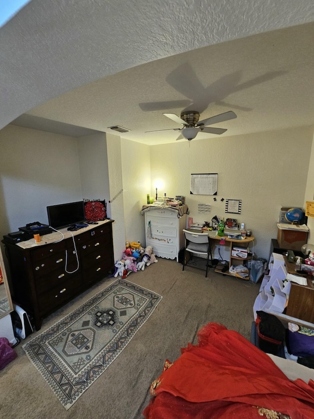 2128 Oakmont Dr Unit 2128, Riviera Beach, FL 33404 - carpeted bedroom with a textured ceiling and a ceiling fan