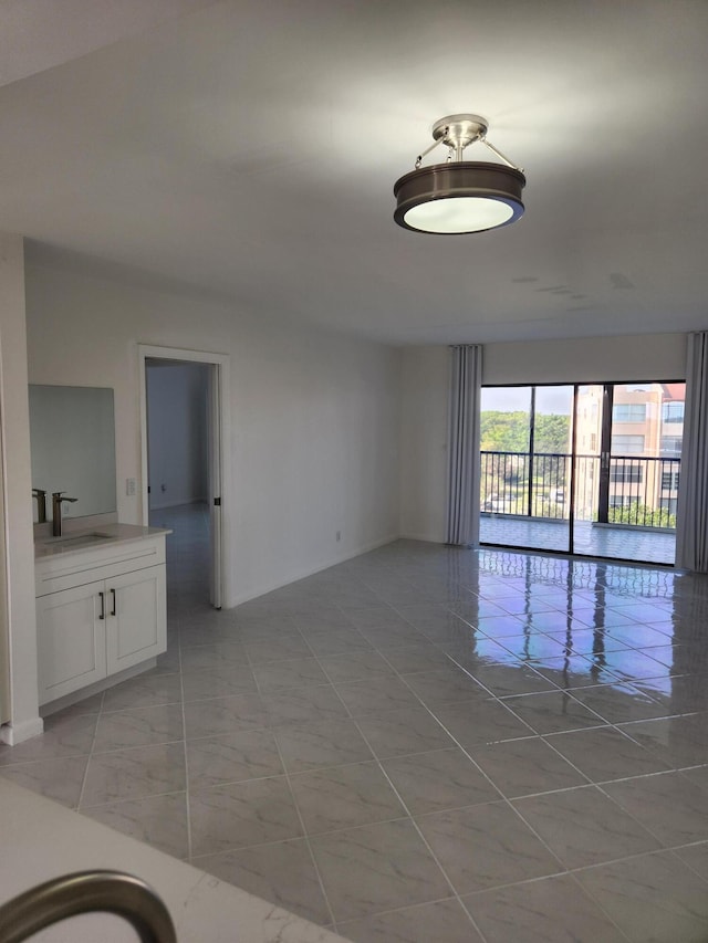 14475 N Strathmore Ln Unit 707, Delray Beach, FL 33446 - spare room with a sink and baseboards
