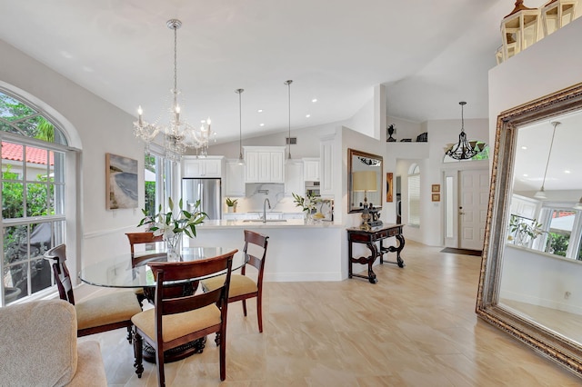 17352 Antigua Point Way, Boca Raton, FL 33487 - dining area with a chandelier, a healthy amount of sunlight, and lofted ceiling