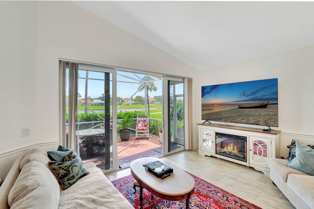 17352 Antigua Point Way, Boca Raton, FL 33487 - living room featuring a glass covered fireplace and high vaulted ceiling