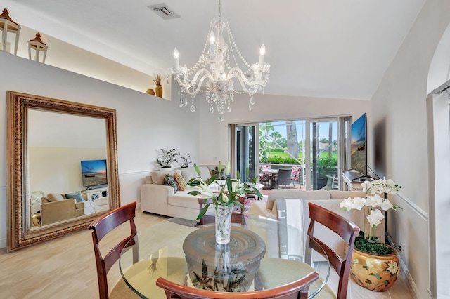 17352 Antigua Point Way, Boca Raton, FL 33487 - dining area featuring a notable chandelier, visible vents, and high vaulted ceiling