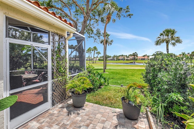 17352 Antigua Point Way, Boca Raton, FL 33487 - view of patio with a water view, view of golf course, and a lanai
