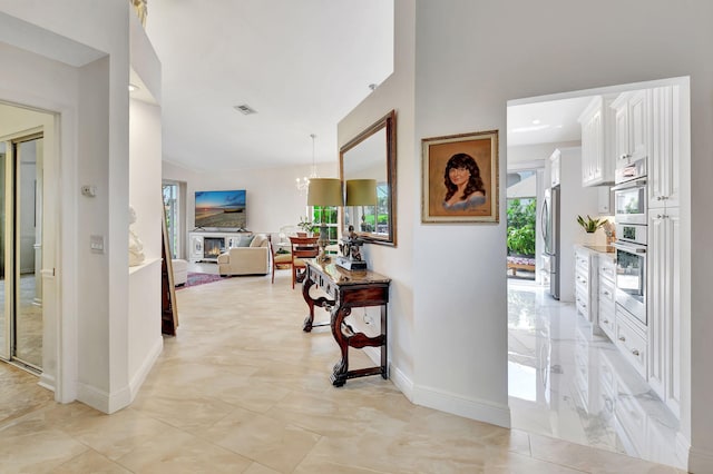 17352 Antigua Point Way, Boca Raton, FL 33487 - hallway featuring baseboards and visible vents