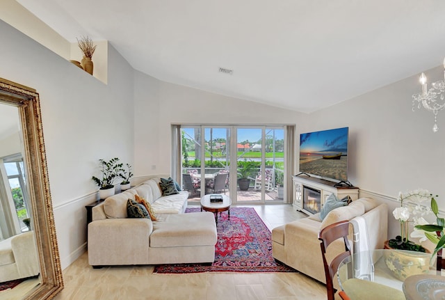 17352 Antigua Point Way, Boca Raton, FL 33487 - living area with visible vents, a notable chandelier, vaulted ceiling, and a wealth of natural light