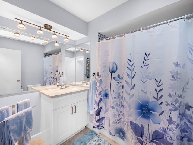 full bathroom featuring toilet and vanity