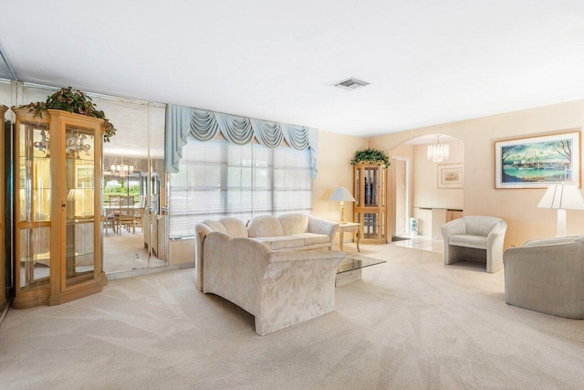 3163 NE 8th Ave, Boca Raton, FL 33431 - carpeted living room with a chandelier and arched walkways