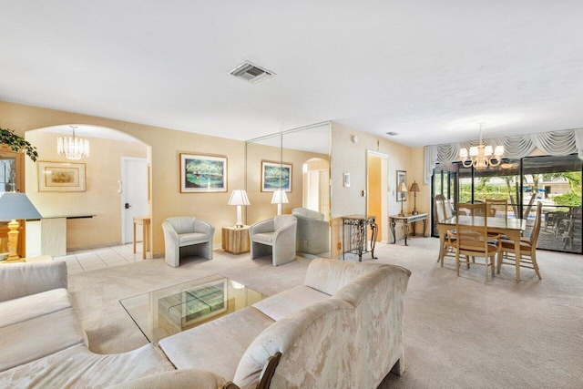 3163 NE 8th Ave, Boca Raton, FL 33431 - carpeted living room with a chandelier and arched walkways