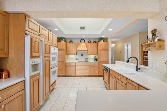 3163 NE 8th Ave, Boca Raton, FL 33431 - kitchen featuring a sink, custom range hood, dishwasher, a tray ceiling, and light countertops