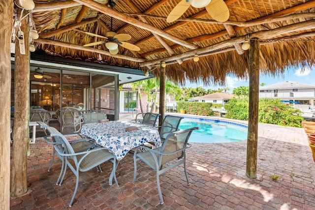 3163 NE 8th Ave, Boca Raton, FL 33431 - view of patio featuring a ceiling fan and an outdoor pool