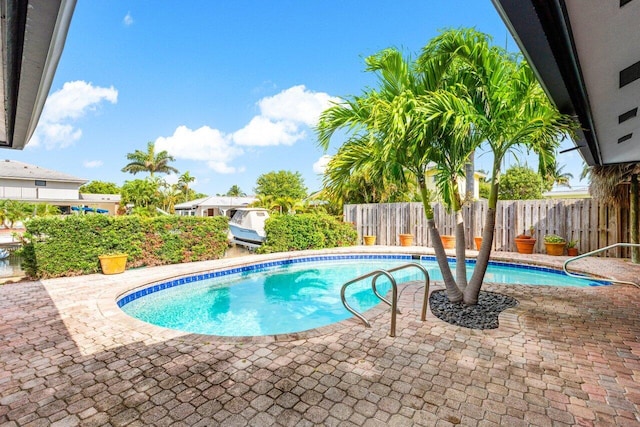 3163 NE 8th Ave, Boca Raton, FL 33431 - view of pool featuring a patio area and a fenced backyard