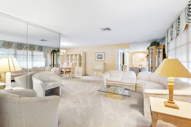 3163 NE 8th Ave, Boca Raton, FL 33431 - living room with carpet floors and a chandelier