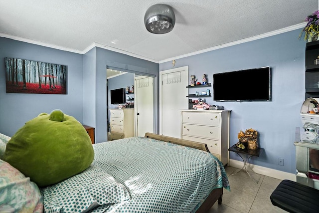 bedroom with tile patterned floors, a textured ceiling, crown molding, and baseboards