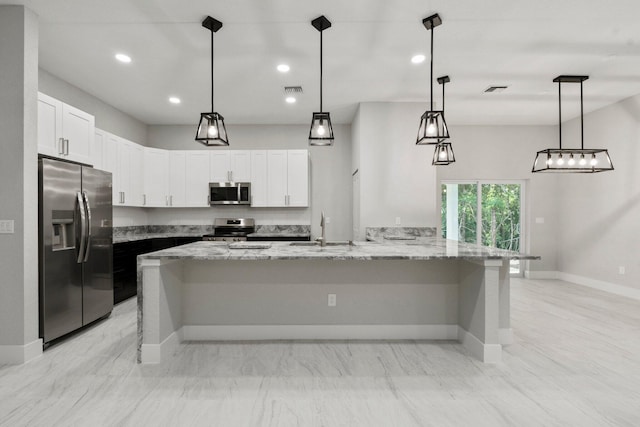 899 Gladiola Ave, Sebastian, FL 32958 - kitchen featuring a sink, light stone counters, white cabinets, and stainless steel appliances