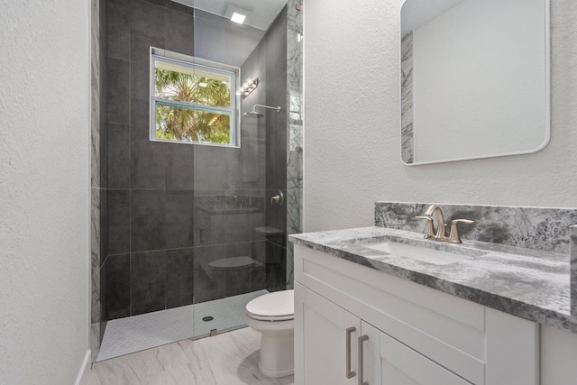 899 Gladiola Ave, Sebastian, FL 32958 - bathroom with a textured wall, walk in shower, vanity, toilet, and marble finish floor