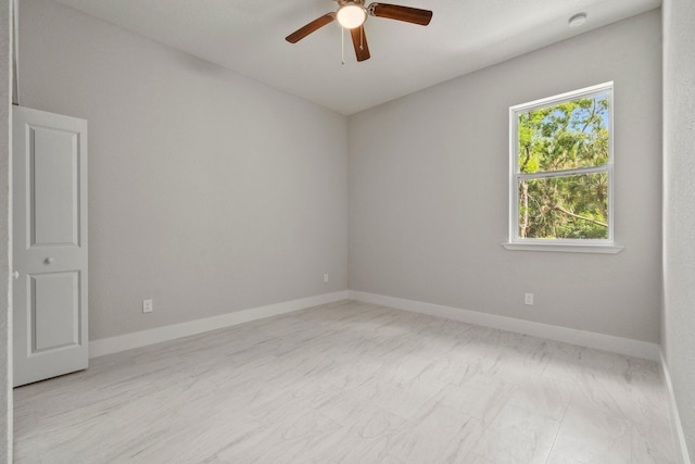 899 Gladiola Ave, Sebastian, FL 32958 - spare room with a ceiling fan, baseboards, and marble finish floor